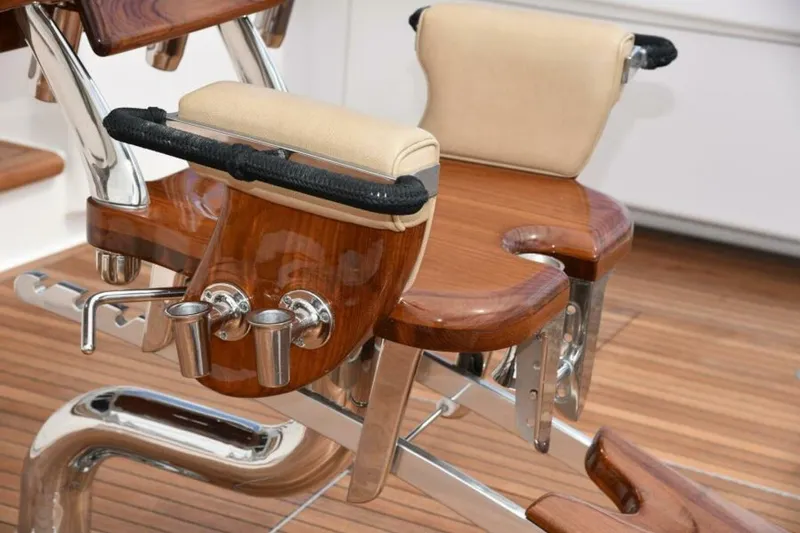 Slide: The Image of Luxurious fishing chair on 2017 Viking 80 Sky Bridge yacht, featuring polished wood and metal accents. - 87