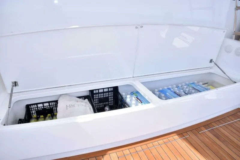 Slide: The Image of Storage compartment on 2017 Viking 80 Sky Bridge yacht, stocked with beverages and supplies. - 97