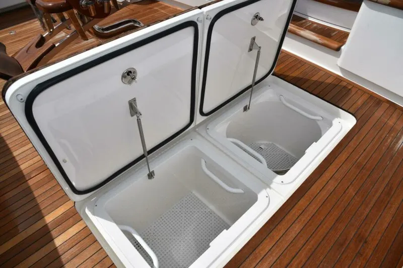 Slide: The Image of Open storage compartments on 2017 Viking 80 Sky Bridge yacht deck. - 98