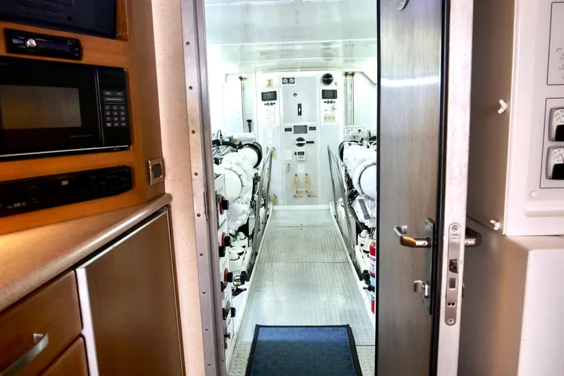 Slide: The Image of Engine room of a 2000 Westport 112 yacht, featuring modern equipment and controls. - 40