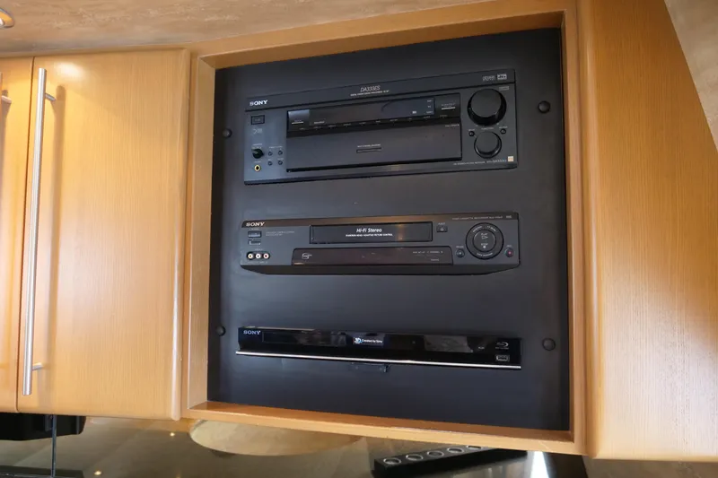Slide: The Image of Sony audio system in a 2000 Westport 112 yacht's wooden cabinet. - 84