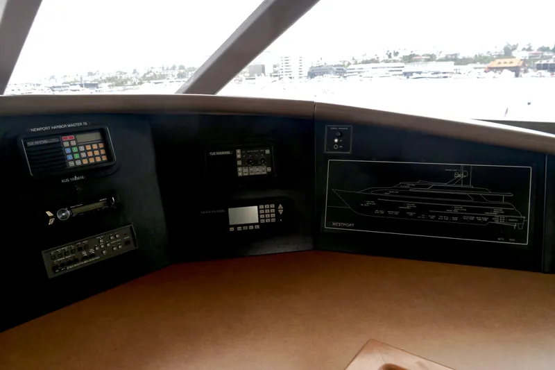 Slide: The Image of Control panel of a 2000 Westport 112 yacht with navigation equipment and yacht diagram. - 92
