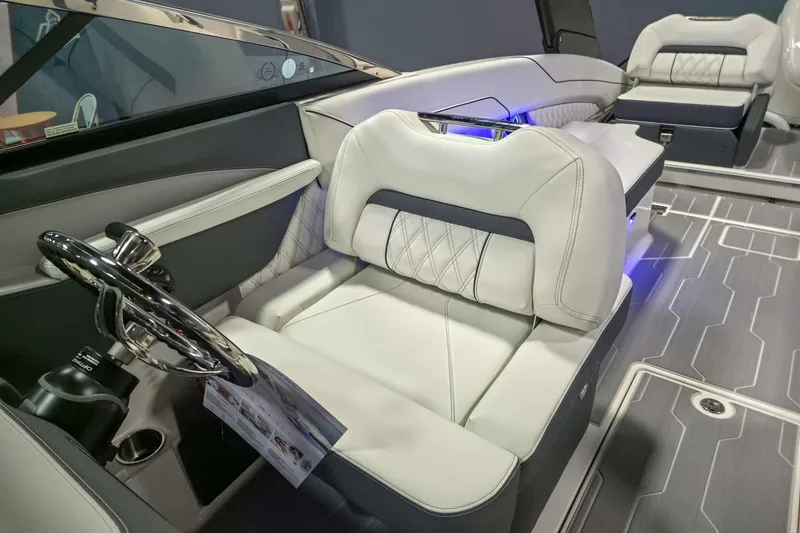 Slide: The Image of 2026 Regal LX6 boat interior with luxurious white seating and modern steering wheel. - 10