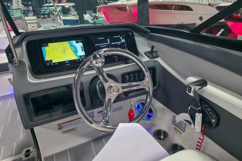 Slide: The Image of 2026 Regal LX6 boat dashboard with GPS navigation and modern controls. - 12