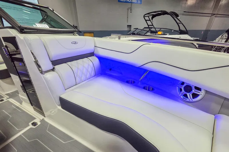 Slide: The Image of 2026 Regal LX6 boat interior with illuminated seating and modern design. - 16