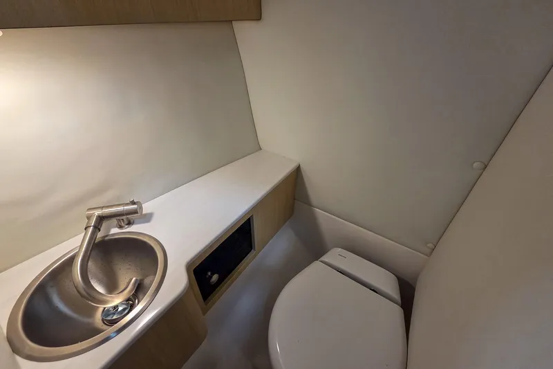 Slide: The Image of 2026 Regal LX6 boat bathroom with sink and toilet, modern design. - 19