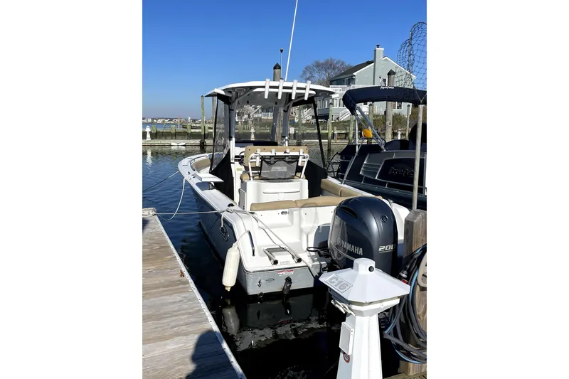 Slide: The Image of 2017 Sea Hunt Ultra 235 SE boat docked with Yamaha engine. - 2