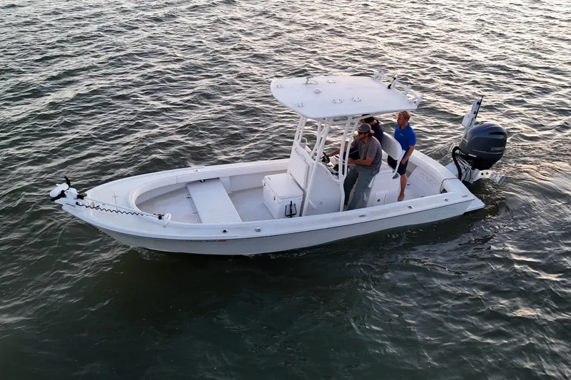 Slide: The Image of 2016 Dorado 23 boat on water with two people onboard. - 0