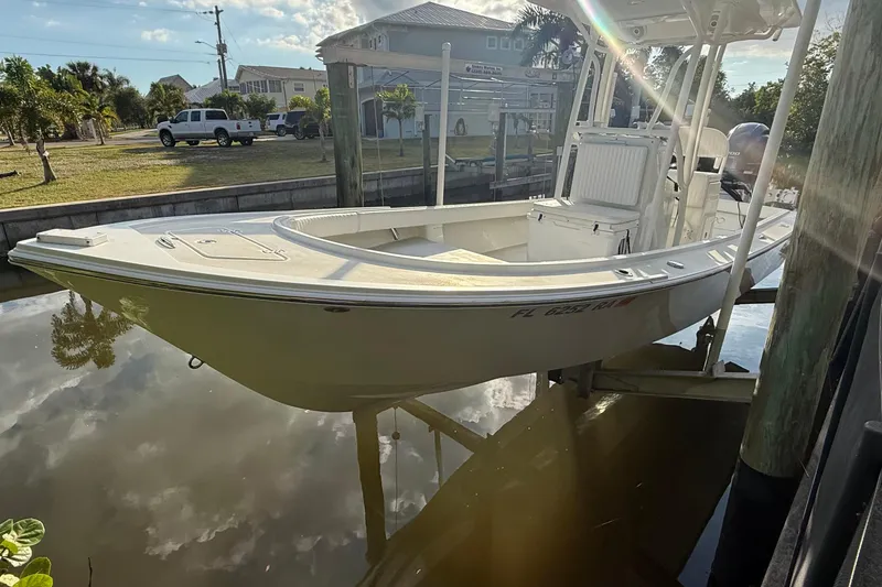 Slide: The Image of 2016 Dorado 23 boat navigating on open water, aerial view. - 1