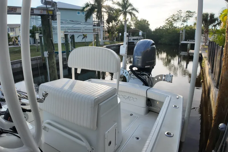Slide: The Image of 2016 Dorado 23 boat docked by a canal with a Yamaha 200 engine. - 20