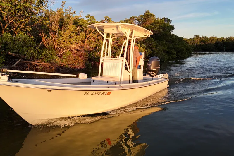 Slide: The Image of 2016 Dorado 23 boat cruising near mangroves at sunset. - 28