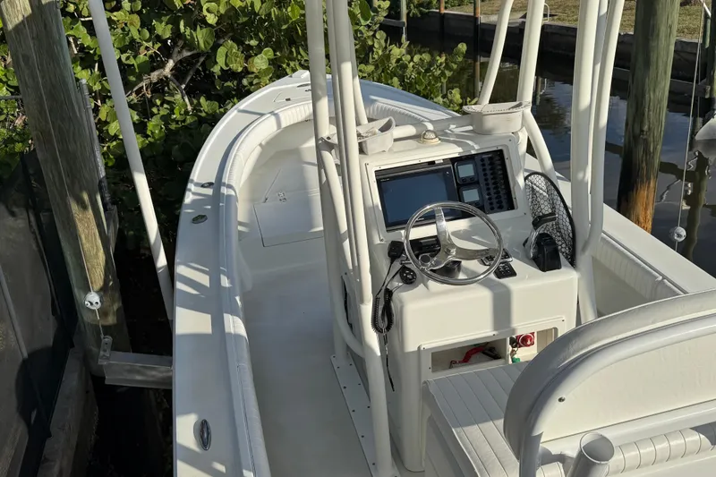 Slide: The Image of 2016 Dorado 23 boat with Yamaha 200 outboard motor docked by the water. - 5