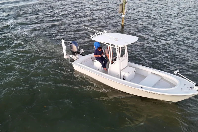 Slide: The Image of Aerial view of 2016 Dorado 23 boat with two people on calm water. - 51