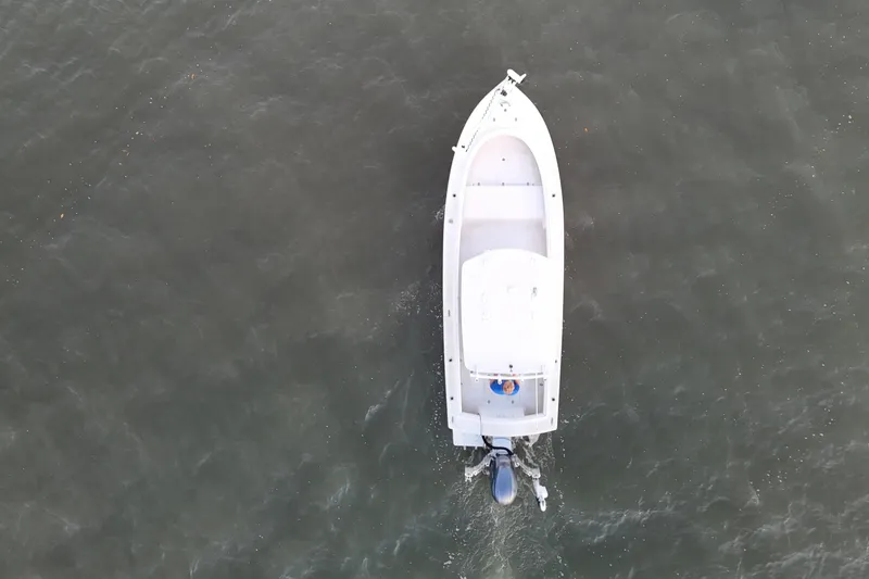 Slide: The Image of Overhead view of 2016 Dorado 23 boat navigating through calm waters. - 53