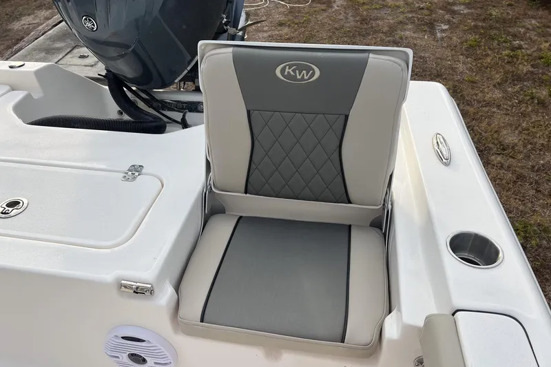 Slide: The Image of 2026 Key West 230 Bay Reef boat seat with gray and white upholstery. - 10