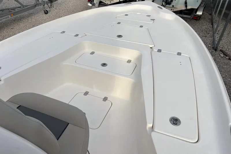 Slide: The Image of 2026 Key West 230 Bay Reef boat deck with storage compartments. - 13