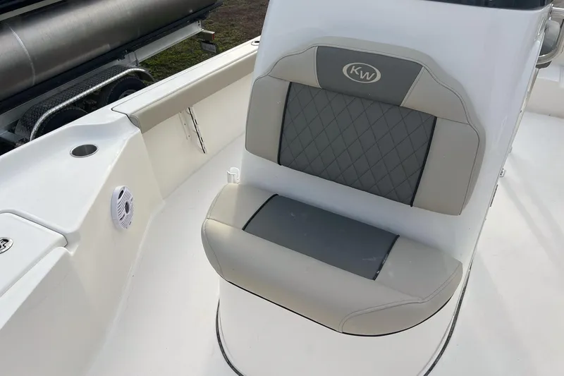 Slide: The Image of 2026 Key West 230 Bay Reef boat seat with diamond-pattern upholstery. - 15