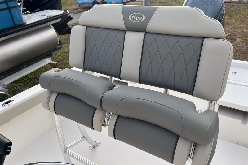Slide: The Image of 2026 Key West 230 Bay Reef boat seat with gray and white cushioned design. - 6