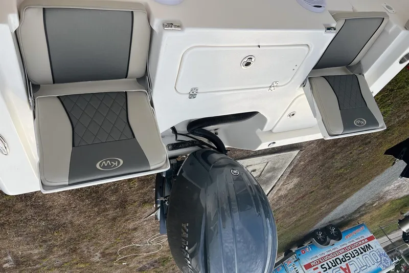 Slide: The Image of 2026 Key West 230 Bay Reef boat seats and engine, showcasing modern design and comfort. - 9