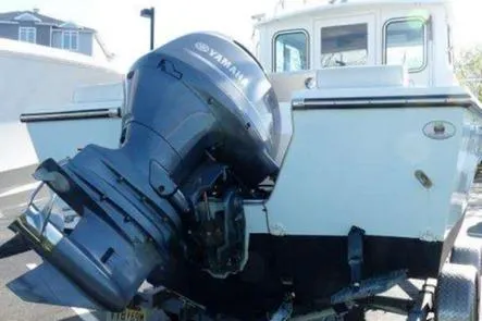 Slide: The Image of 2016 Parker 2120 Sport Cabin interior with steering wheel and Simrad navigation system. - 12