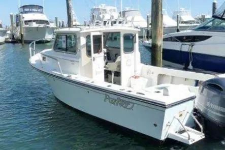 Slide: The Image of 2016 Parker 2120 Sport Cabin boat, close-up view of cabin and logo. - 14