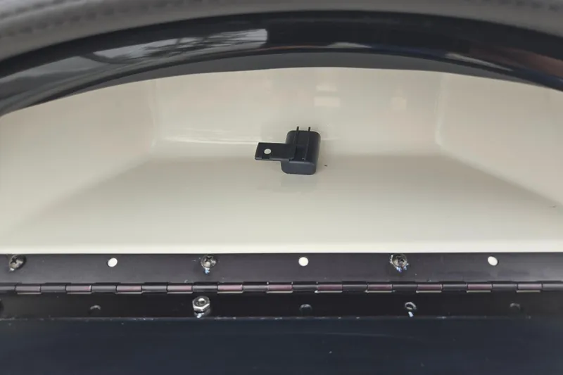 Slide: The Image of 2016 Stingray 198 RX boat compartment with latch detail. - 14