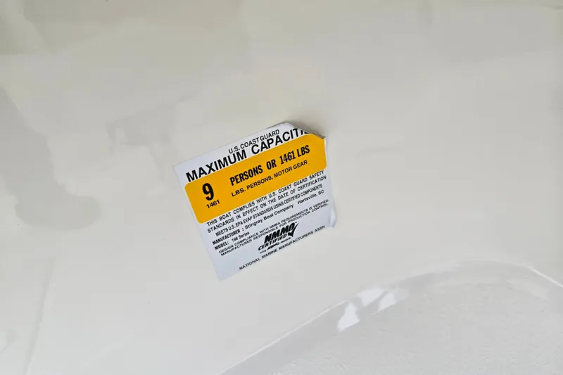 Slide: The Image of 2016 Stingray 198 RX boat capacity label, maximum 9 persons or 1461 lbs. - 17