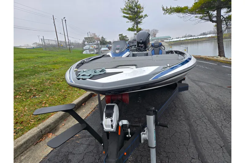 Slide: The Image of 2021 Skeeter FXR20 boat on trailer near a lake, ready for launch. - 6
