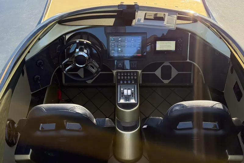 Slide: The Image of Cockpit of 2002 MTI 40RP boat with modern steering and digital controls. - 10