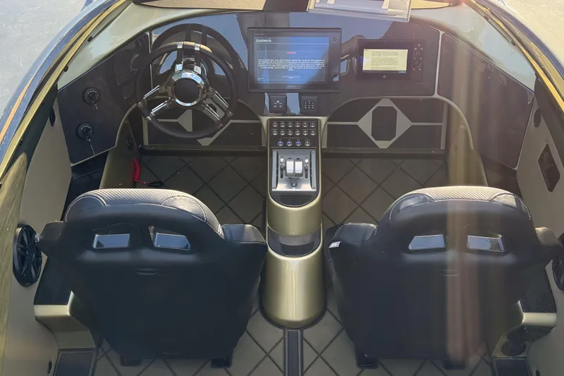 Slide: The Image of Interior of a 2002 MTI 40RP boat with modern dashboard and dual seats. - 11