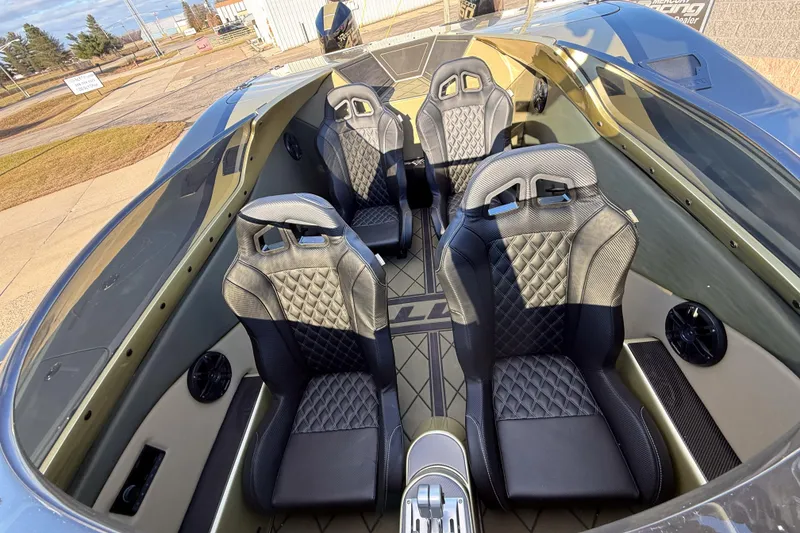 Slide: The Image of 2002 MTI 40RP boat interior with four luxury seats and sleek design. - 12