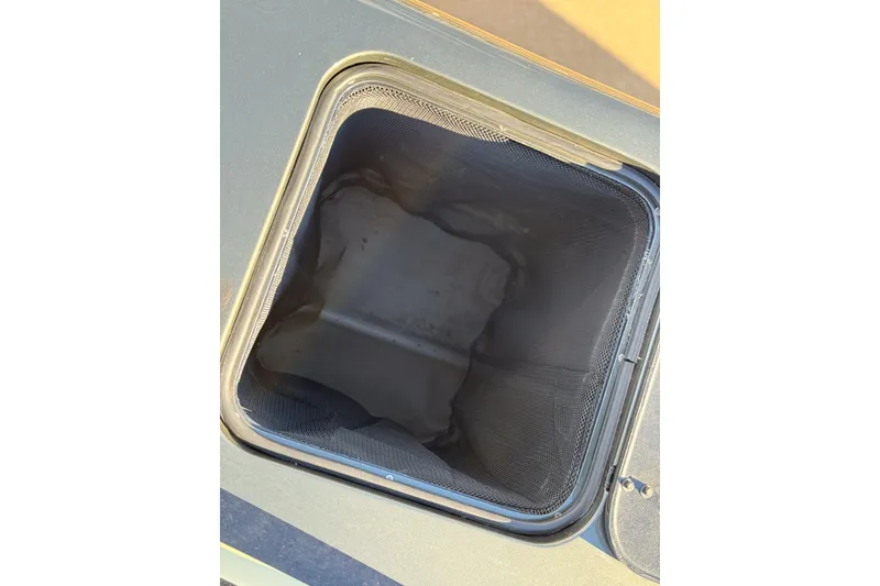 Slide: The Image of Open storage compartment on MTI 40RP, 2002 model, with visible interior lining. - 19