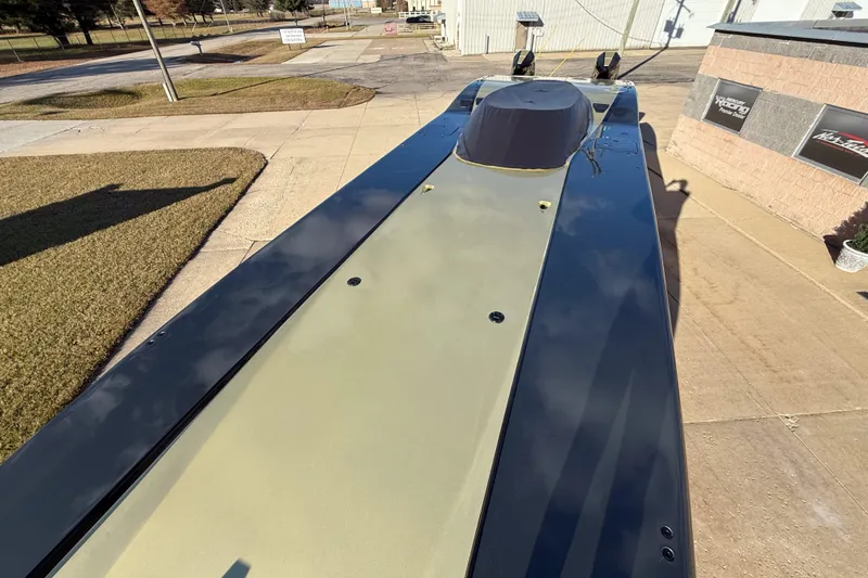 Slide: The Image of 2002 MTI 40RP powerboat on pavement, showcasing sleek design and aerodynamic features. - 22