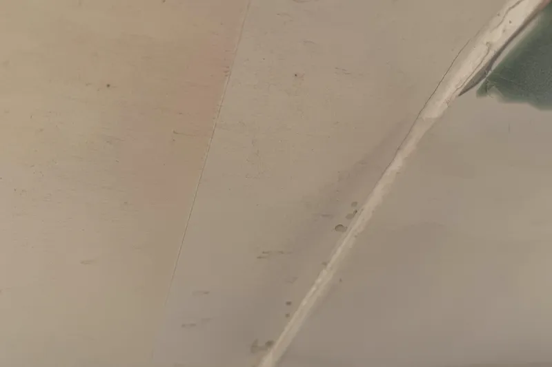 Slide: The Image of Close-up of a 2002 MTI 40RP surface with visible wear and texture. - 23