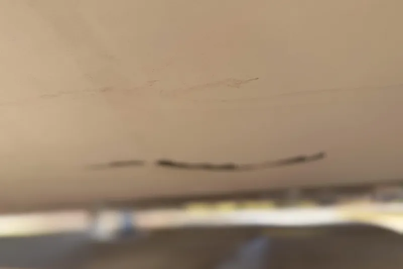 Slide: The Image of Close-up of MTI 40RP 2002 model surface with visible marks and scratches. - 31