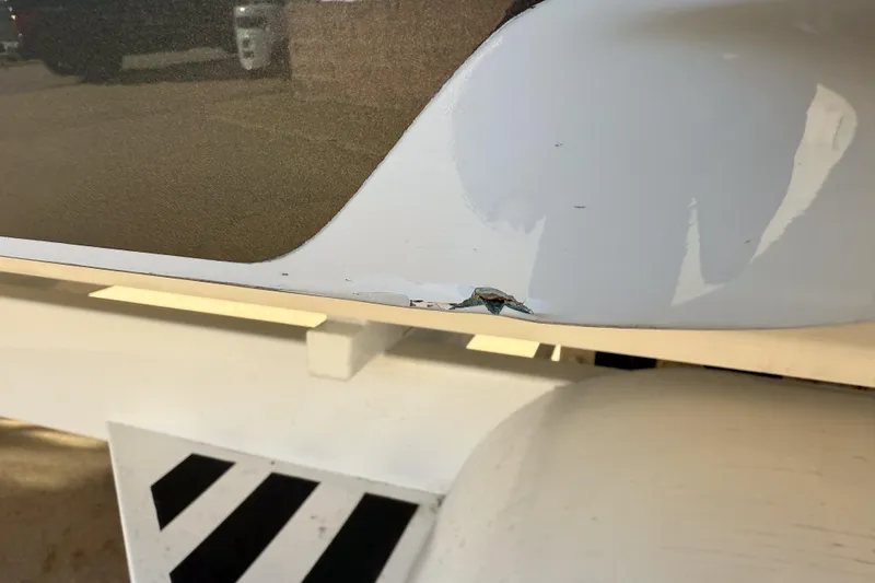 Slide: The Image of Damaged MTI 40RP boat hull with visible crack, 2002 model. - 39