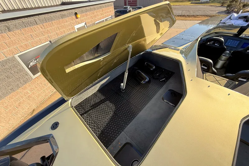 Slide: The Image of Open engine compartment of a 2002 MTI 40RP boat, showcasing interior details. - 5