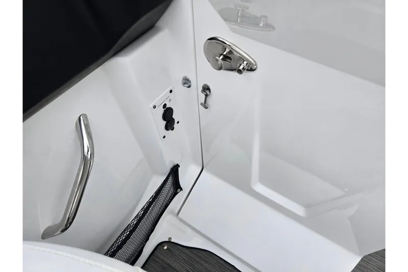 Slide: The Image of Interior detail of 2021 Scarab 255 ID boat, featuring sleek handle and control panel. - 16