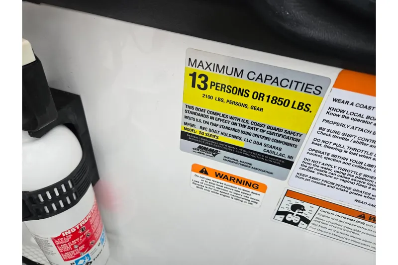 Slide: The Image of 2021 Scarab 255 ID boat capacity label, maximum 13 persons or 1850 lbs. - 17