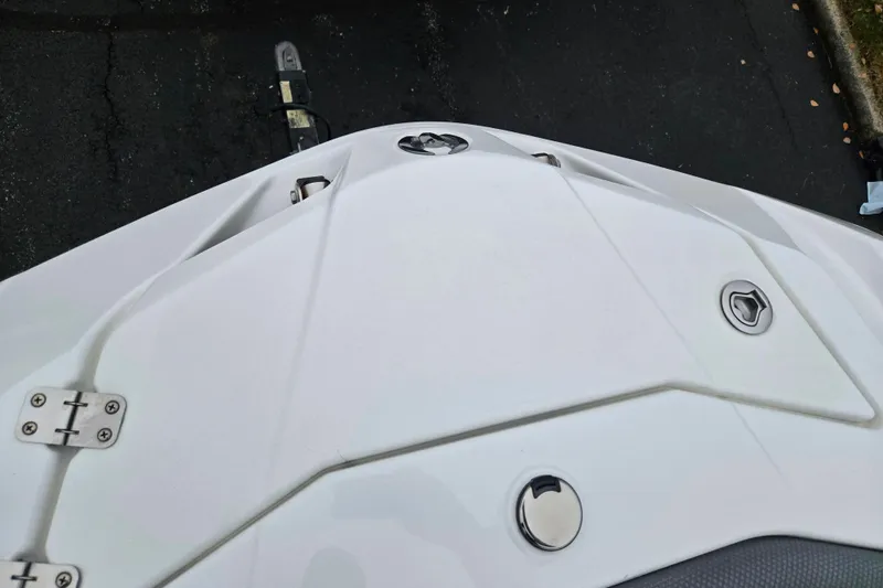 Slide: The Image of 2021 Scarab 255 ID boat deck with sleek white design and metal fixtures. - 23