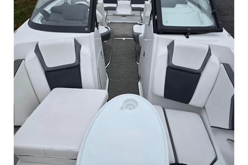 Slide: The Image of 2021 Scarab 255 ID boat interior with white and gray seating, modern design. - 24