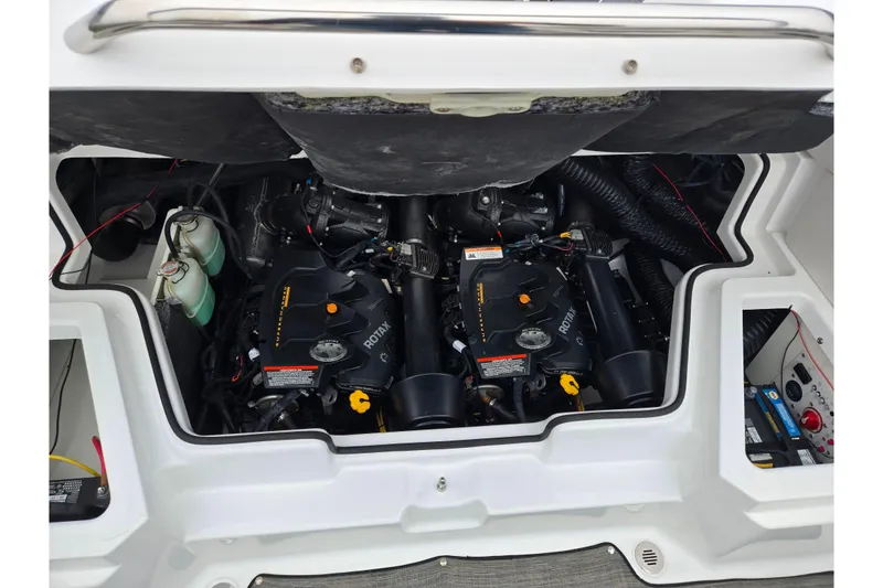 Slide: The Image of Engine compartment of a 2021 Scarab 255 ID boat, featuring dual Rotax engines. - 27