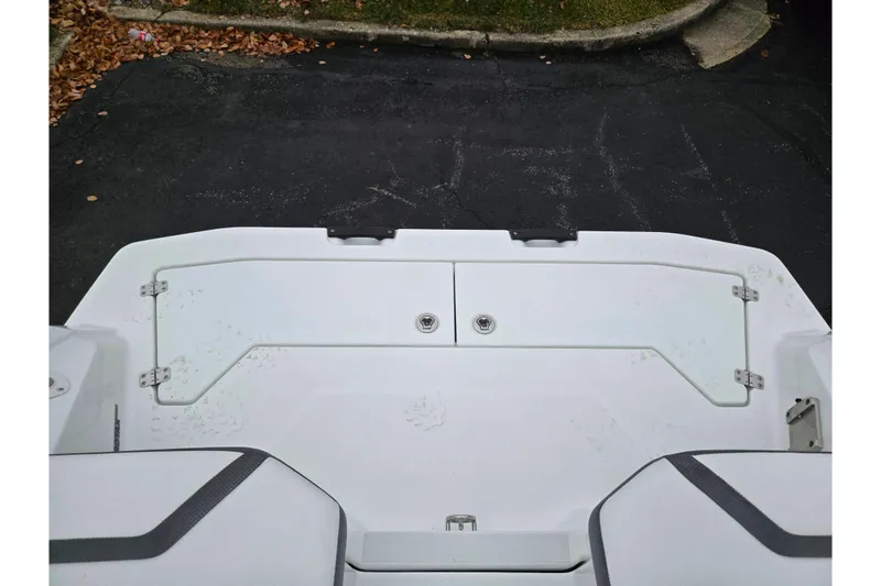 Slide: The Image of 2021 Scarab 255 ID boat deck with storage compartments, viewed from above. - 29