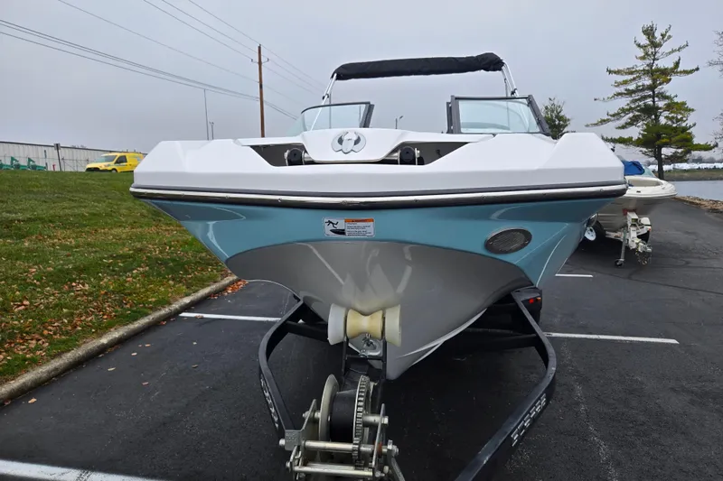 Slide: The Image of 2021 Scarab 255 ID boat on trailer in parking lot, front view. - 6