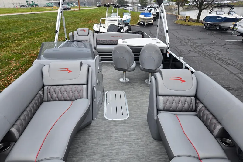 Slide: The Image of 2022 Bennington LX 24 Swingback pontoon boat with luxurious gray seating and modern design. - 11