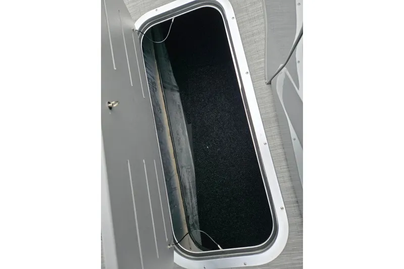 Slide: The Image of Storage compartment of 2022 Bennington LX 24 Swingback boat, open and empty. - 23