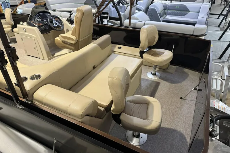 Slide: The Image of 2025 Veranda Fish VF20F4 boat interior with beige seating and modern dashboard. - 2