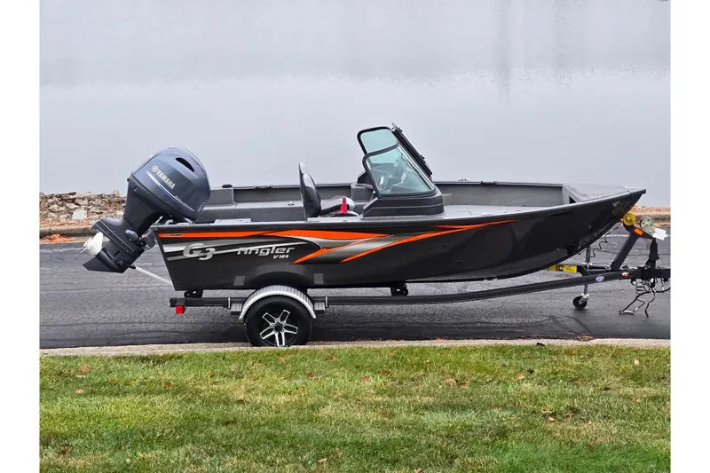 The Image of 2022 G3 Angler V164 F boat with Yamaha motor on trailer, parked on pavement. - 0