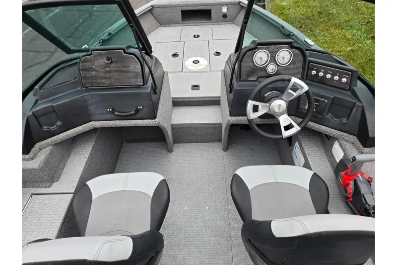 Slide: The Image of 2022 G3 Angler V164 F boat interior with steering wheel and seating. - 10