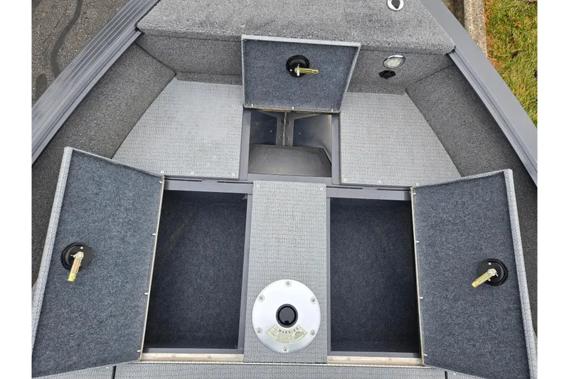 Slide: The Image of 2022 G3 Angler V164 F boat interior with open storage compartments. - 15